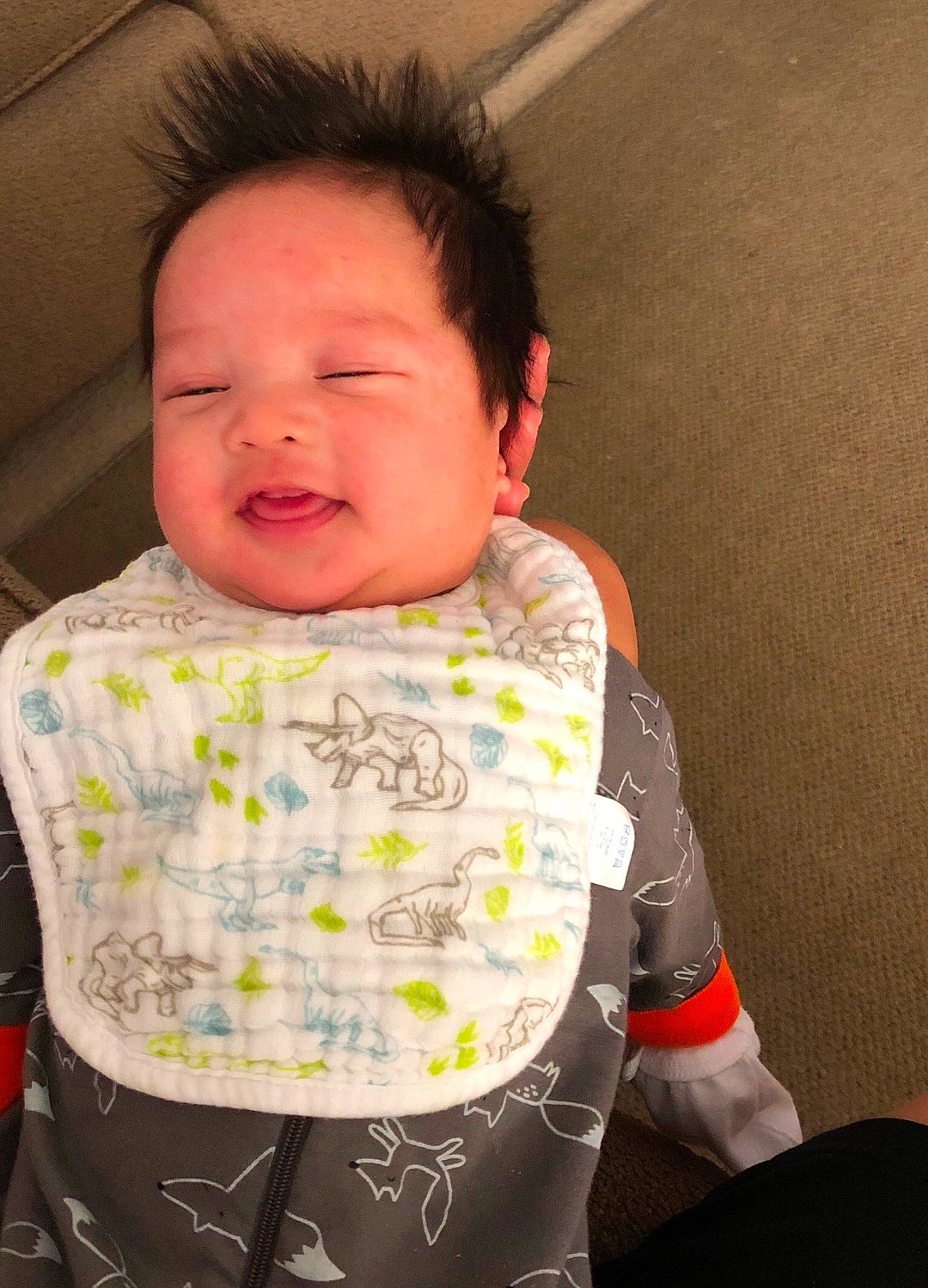 Julian is registered to the contest to win money with this photo: baby_products, cheek, child, day, eye, facial_expression, infant, person, product, sitting, skin, smile, textile, toddler