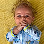 Oliver is registered to the contest to win money with this photo: adorable, baby, blanket, blue, child, clothing, cute, donald_duck, expression, face, hair, hands, infant, lying_down, mickey_mouse, onesie, playful, portrait, soft_texture, yellow