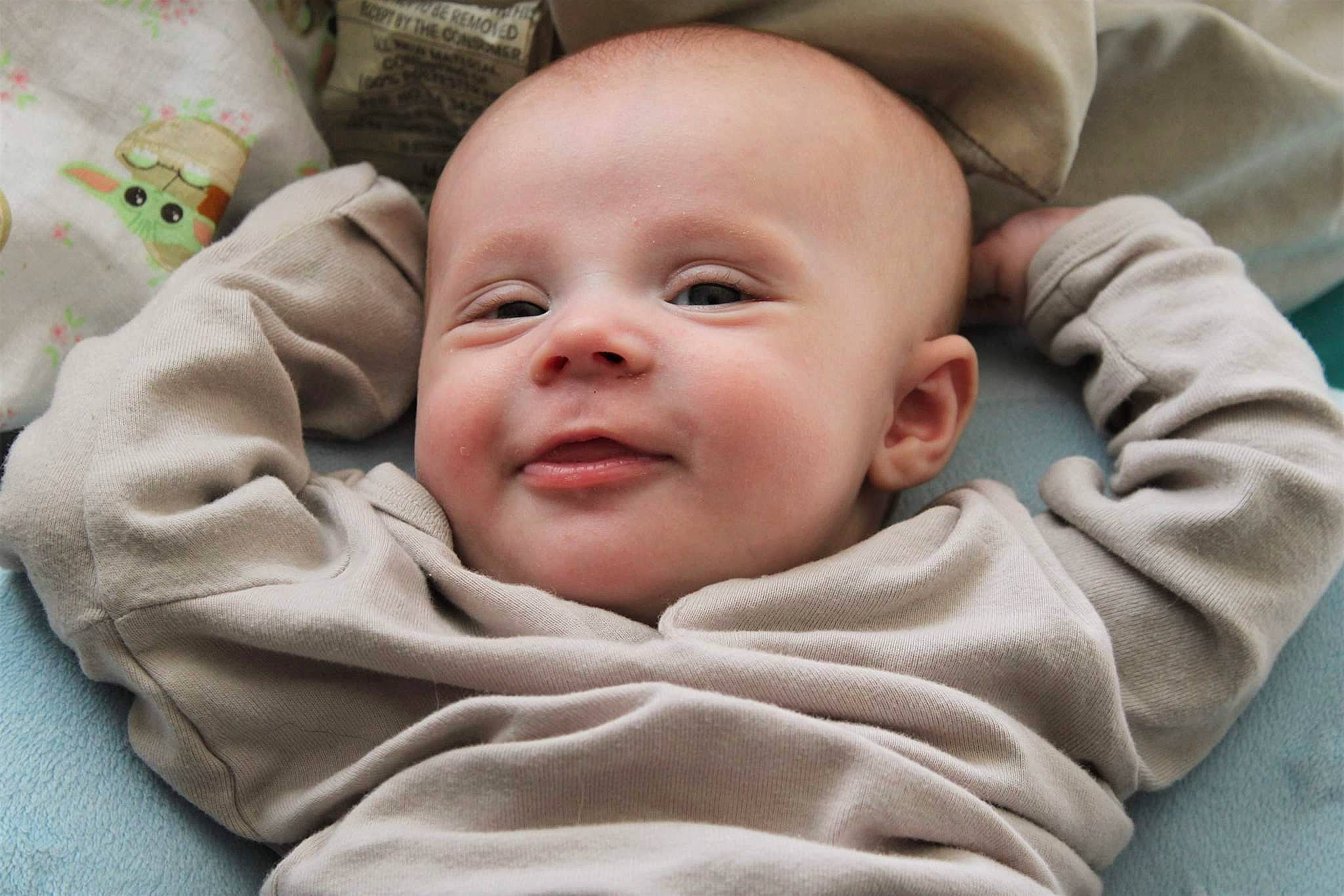 Silas is registered to the contest to win money with this photo: baby, baby_products, baby_toddler_clothing, cheek, child, chin, close_up, comfort, eye, happy, head, iris, linens, mouth, nose, person, product, skin, sleeve, smile