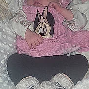 Zaïna participe au concours pour gagner de l'argent avec cette photo : baby, sleeping, headband, flower, blanket, knitted_booties, pink_clothing, black_pants, cozy, infant, cute, resting, soft_texture, toddler, child, portrait, indoors, peaceful, closeup, young