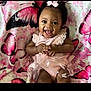 baby, blanket, butterfly, child, clothing, cute, dress, eyes, face, girl, hands, happy, indoor, infant, laying, pink, portrait, ribbon, smile, tulle