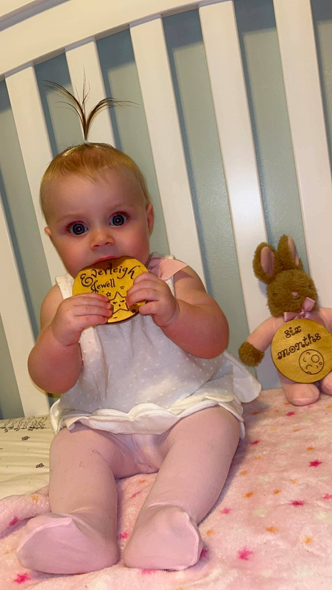 Everleigh is registered to the contest to win money with this photo: abdomen, baby, baby_toddler_clothing, cheek, chest, child, eye, finger, joint, leg, orange, organ, person, pink, product, skin, stomach, surprise, thigh, thumb