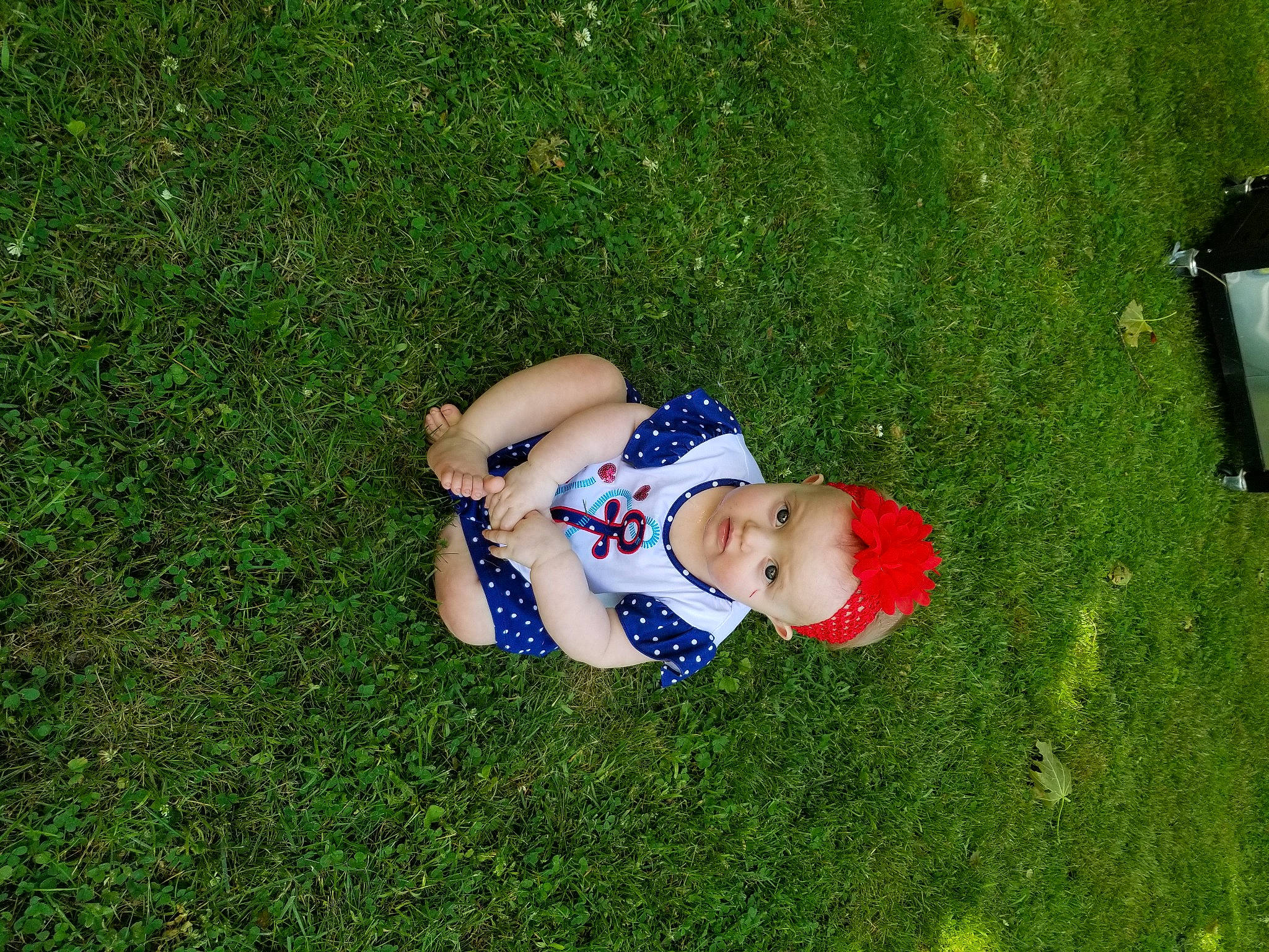 Monroe is registered to the contest to win money with this photo: baby, baby_toddler_clothing, flooring, fun, grass, grass_family, grassland, groundcover, happy, hat, landscape, lawn, leisure, meadow, people_in_nature, person, plant, recreation, shrub, toddler