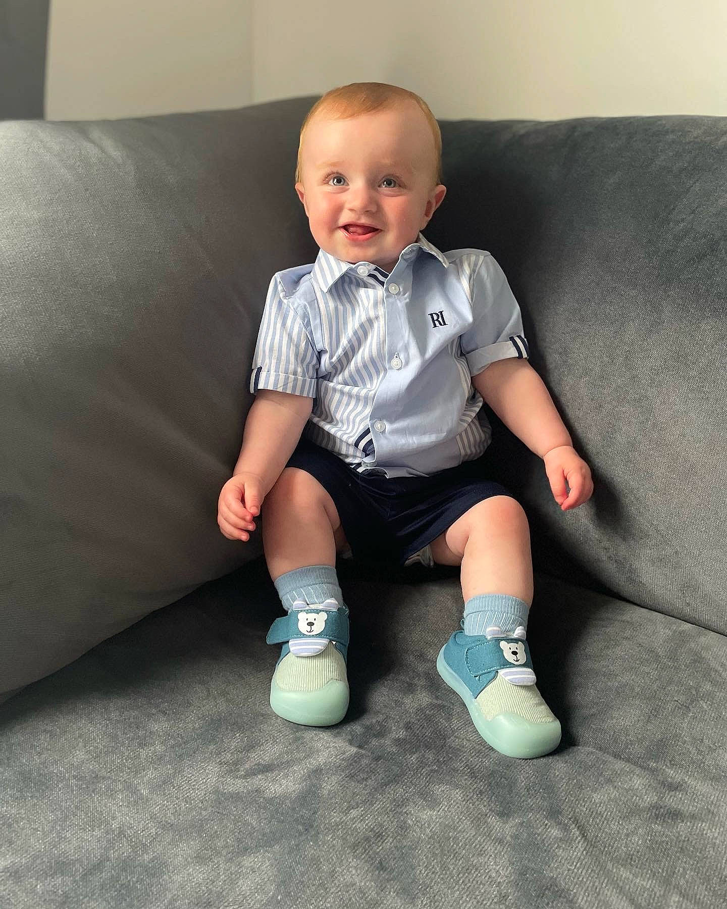 Brodie joined the competition — help win amazing prizes! baby, baby_toddler_clothing, comfort, couch, electric_blue, face, facial_expression, flash_photography, flooring, hairstyle, happy, head, joy, knee, person, skin, sleeve, smile, sock, sportswear