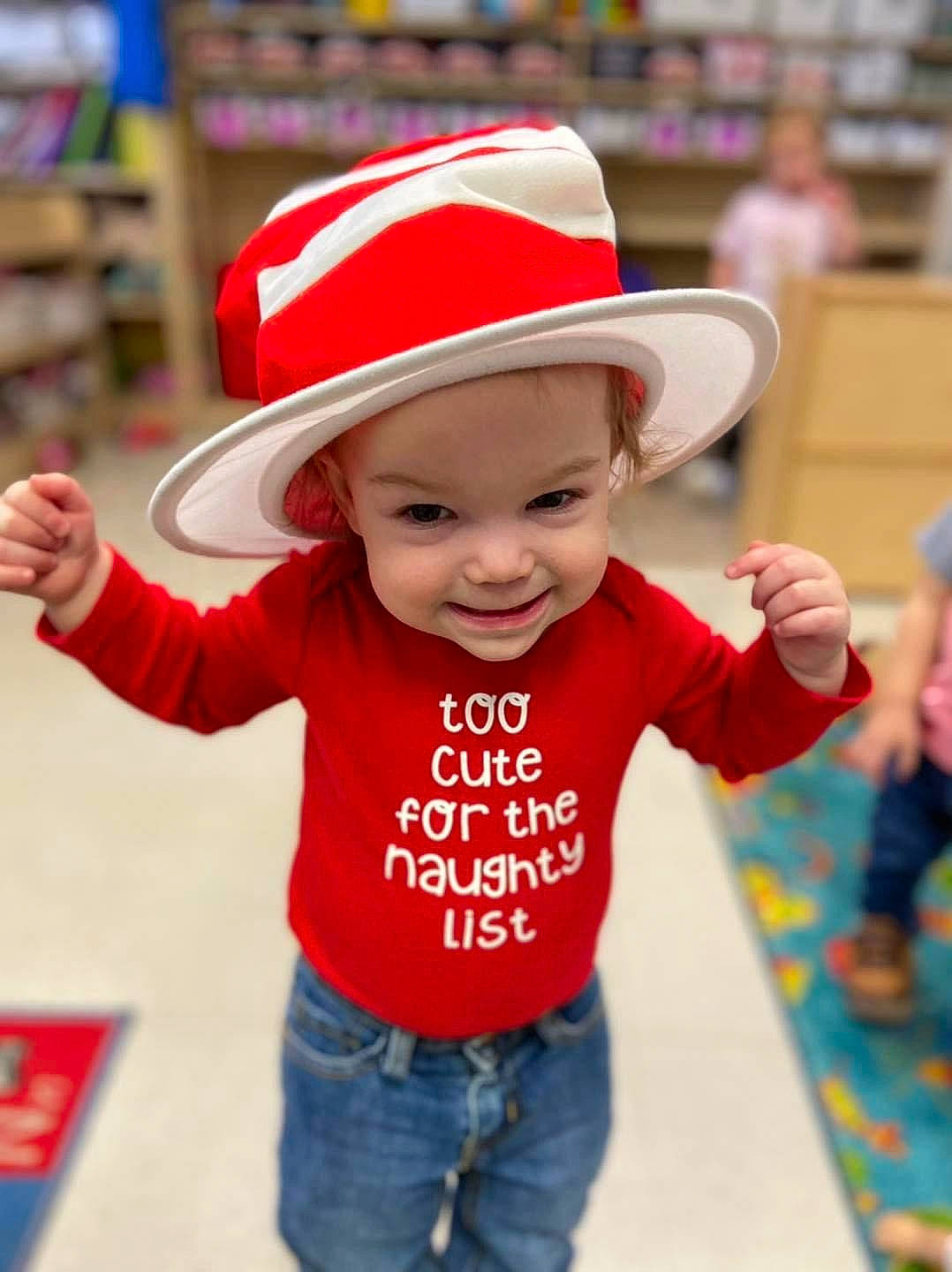 Daesy is registered to the contest to win money with this photo: baby, baby_toddler_clothing, cap, child, clothing, facial_expression, happy, hat, headwear, human, jeans, joy, mammal, person, product, red, skin, sleeve, smile, standing