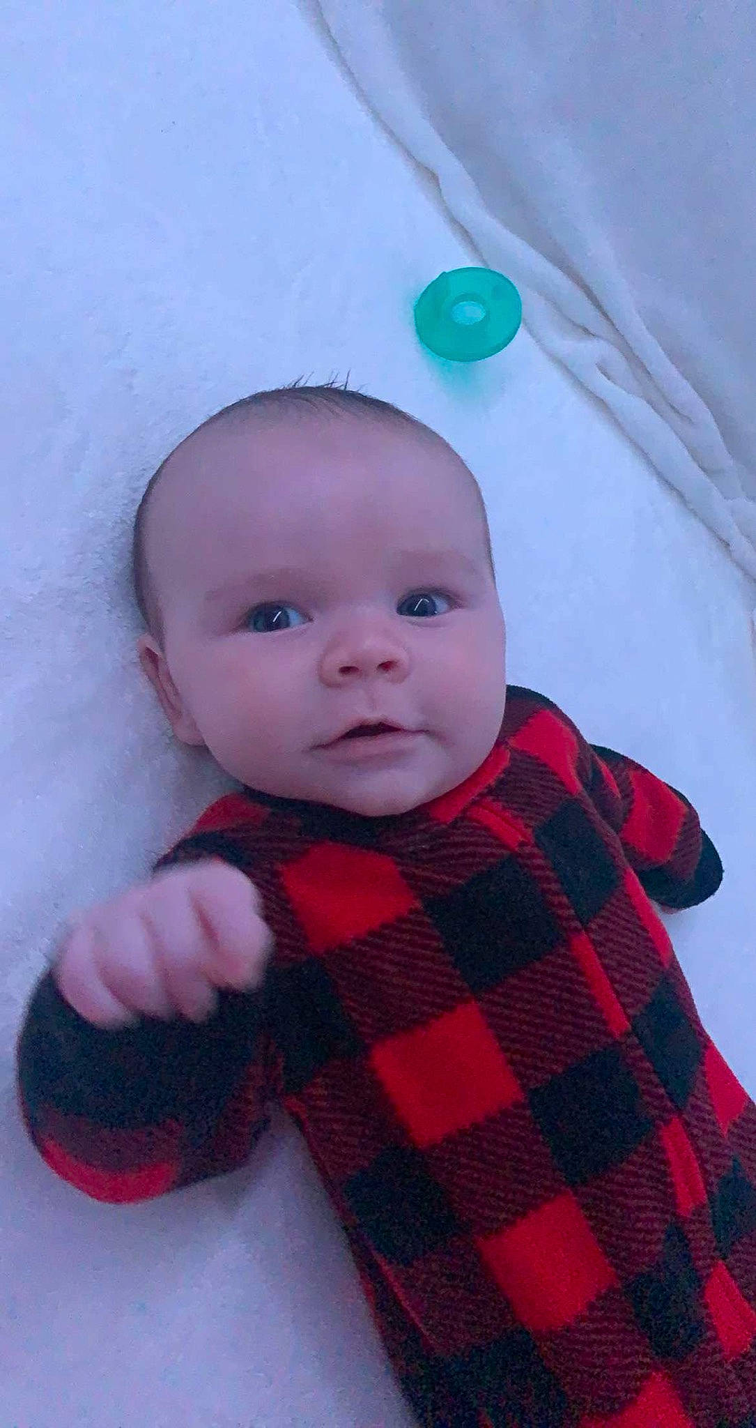 Maverick is registered to the contest to win money with this photo: baby, baby_toddler_clothing, cheek, child, chin, collar, eye, face, head, iris, lip, pattern, person, pink, plaid, red, skin, sleeve, tartan, textile