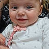 adult, baby, child, close_up, cuddling, eyes, face, happy, headband, indoor, infant, parent, photography, pink_bow, polka_dots, portrait, sitting, smiling, sparkly_details, white_clothing