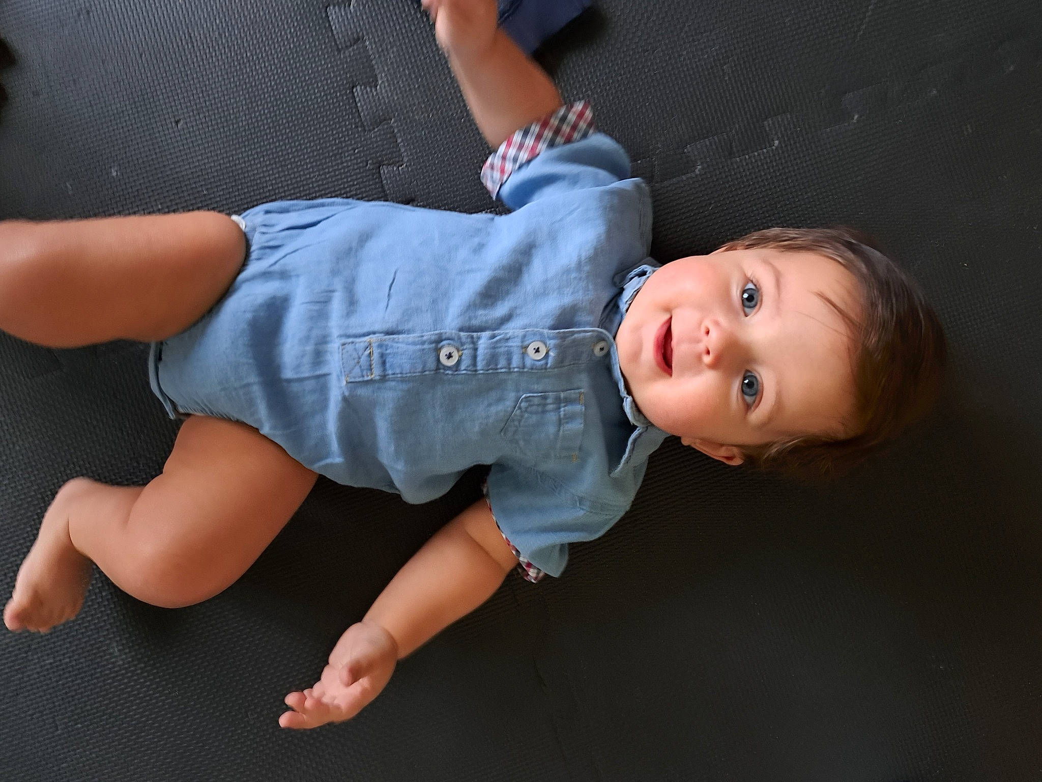 Cohen is registered to the contest to win money with this photo: baby, baby_toddler_clothing, denim, elbow, finger, flash_photography, foot, fun, gesture, grass, hand, human_leg, knee, leg, person, sleeve, smile, t_shirt, thigh, thumb