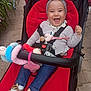 Anna Isabella a rejoint le concours — aidez-le/la à gagner de superbes lots ! baby, stroller, child, laughing, headband, cardigan, toy, outdoor, pavement, greenery, footwear, jeans, red, happy, smiling, person, infant, seatbelt, playful, cute