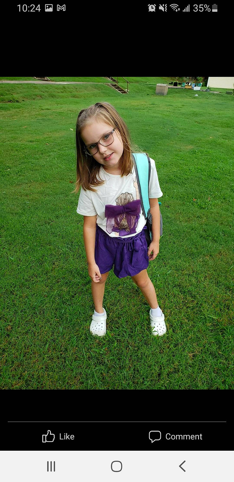 Sarah is registered to the contest to win money with this photo: baby_toddler_clothing, child, cool, electric_blue, fun, grass, grassland, happy, human_leg, lawn, magenta, pattern, people_in_nature, person, recreation, shorts, sleeve, smile, summer, t_shirt