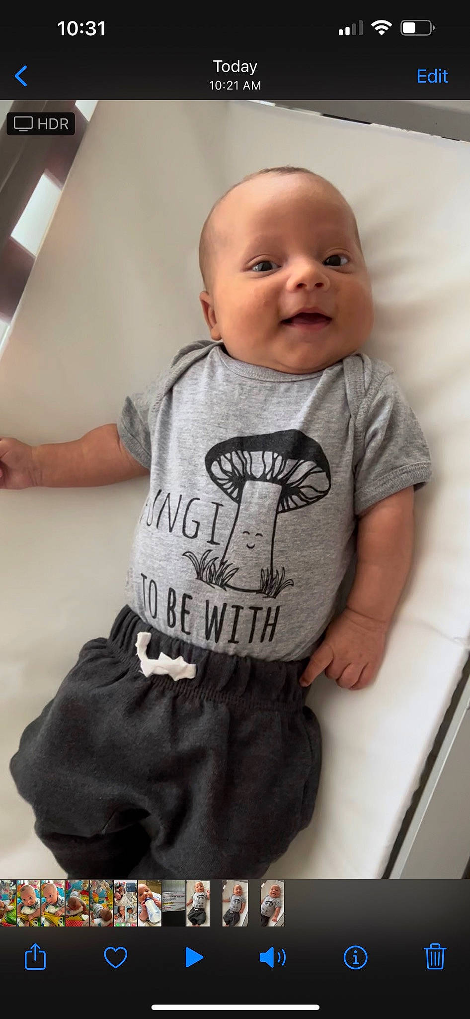 Leonardo is registered to the contest to win money with this photo: baby, baby_toddler_clothing, cheek, comfort, eye, eyebrow, finger, gesture, happy, jersey, joint, neck, person, shoulder, skin, sleeve, smile, standing, t_shirt, toddler