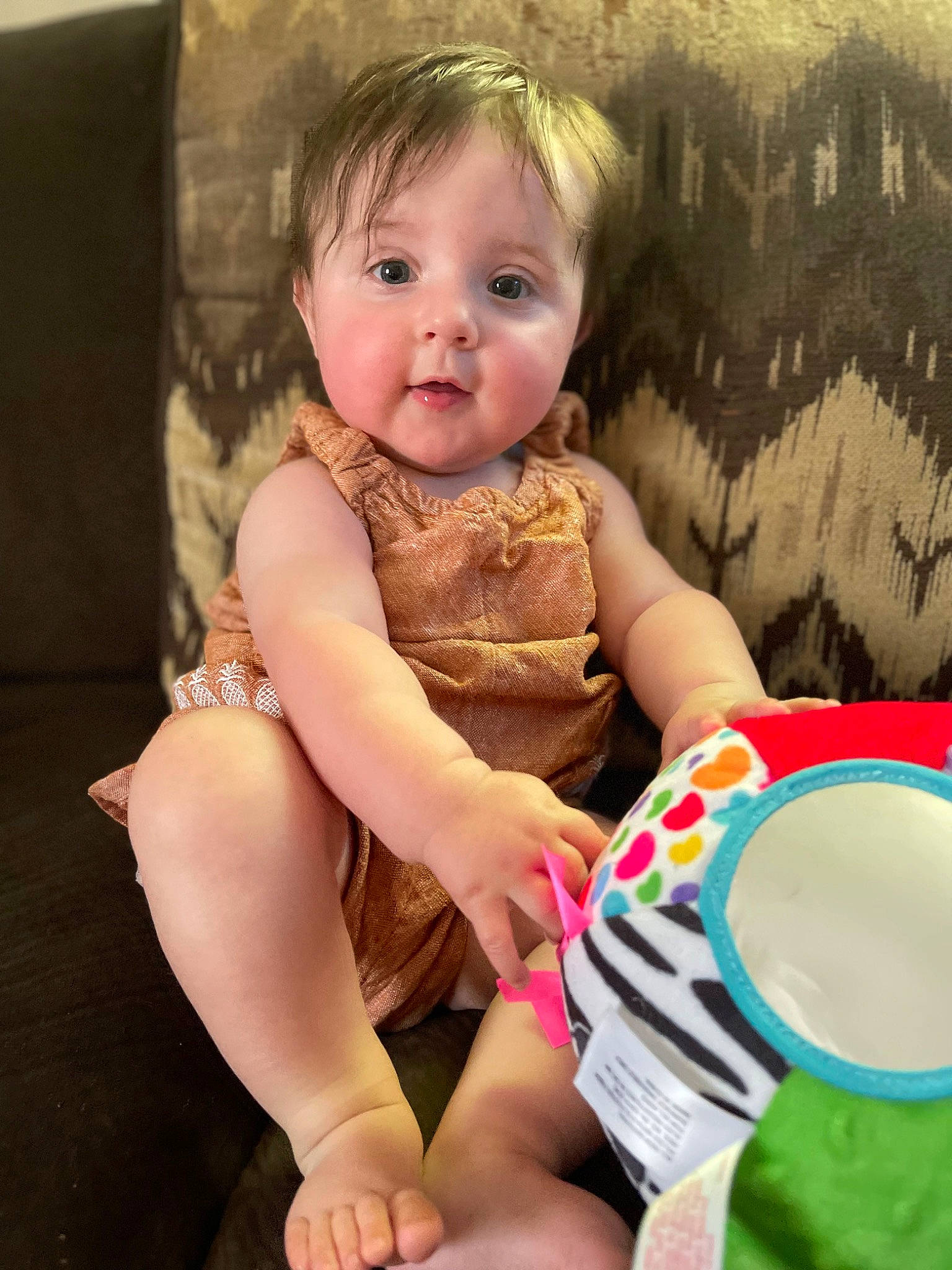 Alayna joined the competition — help win amazing prizes! abdomen, baby, baby_toddler_clothing, cheek, child, comfort, elbow, eye, foot, fun, happy, human_leg, knee, lap, pattern, person, pink, sitting, surprise, thigh