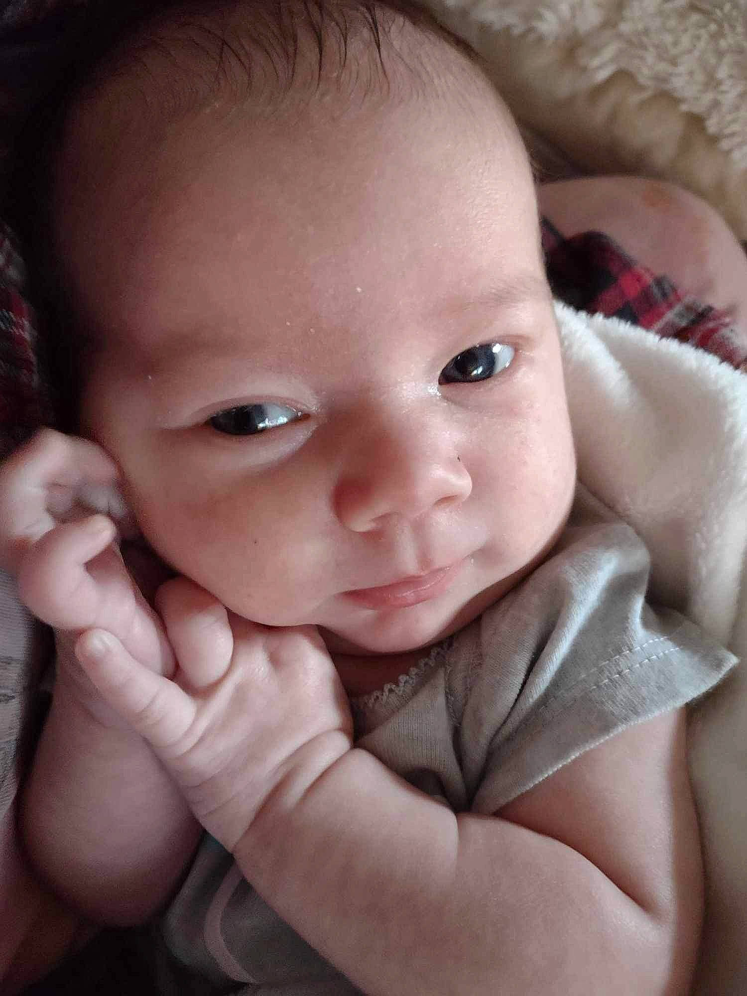 Scarlett is registered to the contest to win money with this photo: arm, baby, cheek, chin, comfort, ear, eye, eyebrow, eyelash, facial_expression, flash_photography, hand, human_body, iris, lip, mouth, neck, nose, person, skin