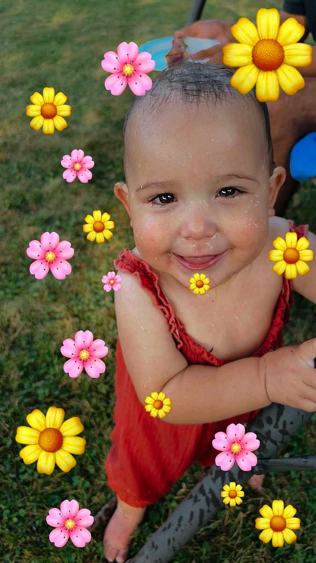 Karter is registered to the contest to win money with this photo: toddler, child, smiling, wet_hair, red_outfit, grass, outdoor, barefoot, happy, playful, flower_emojis, cute, portrait, summer, nature, skin, baby, person, fun, joyful