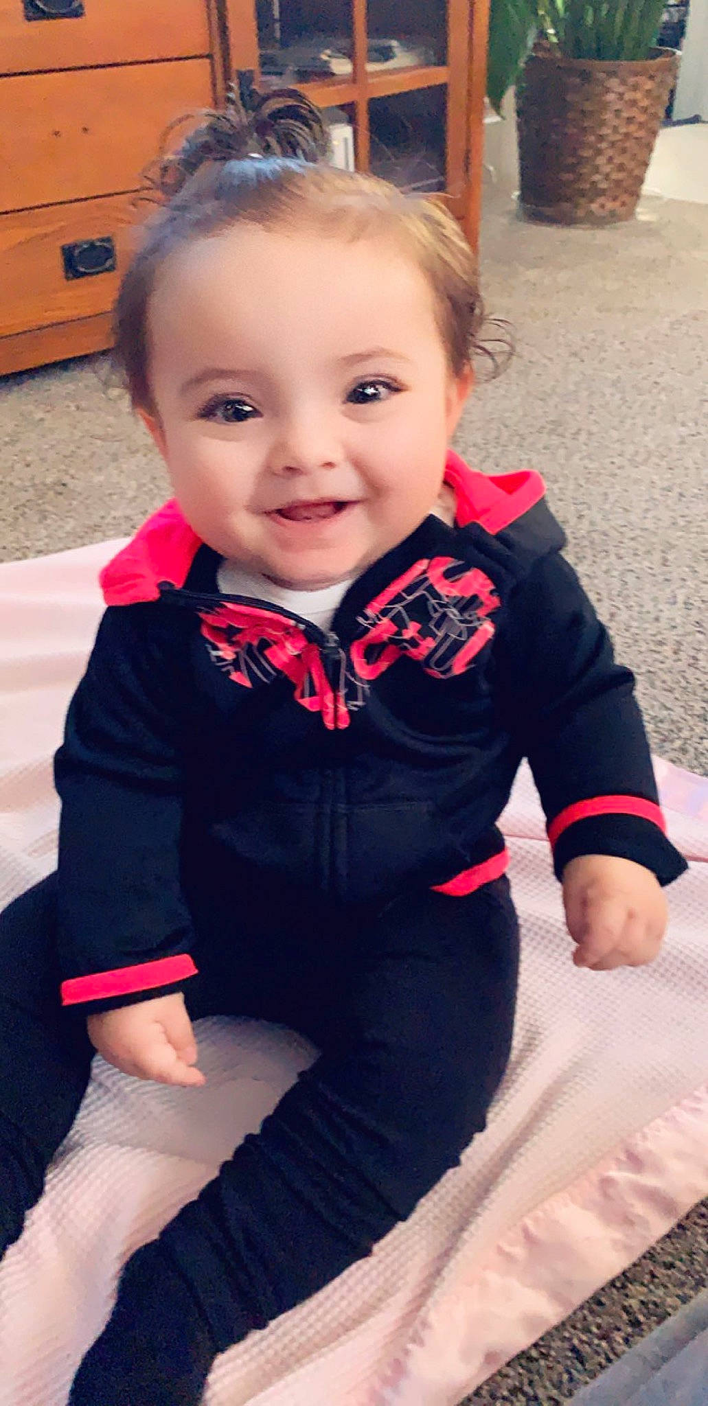 Kinlee is registered to the contest to win money with this photo: arm, baby, baby_toddler_clothing, cheek, child, child_model, leg, outerwear, person, skin, sleeve, smile, toddler