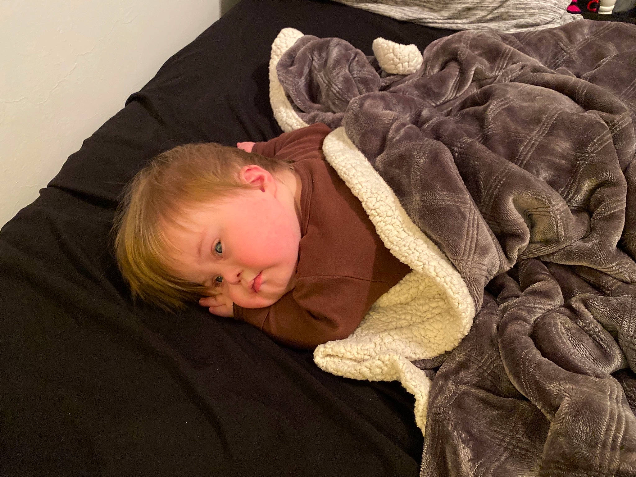 Justin Jr. joined the competition — help win amazing prizes! baby, baby_toddler_clothing, brown, cheek, child, comfort, couch, fur, hairstyle, jacket, linens, mammal, outerwear, person, sitting, skin, sleeve, textile, toddler, vertebrate