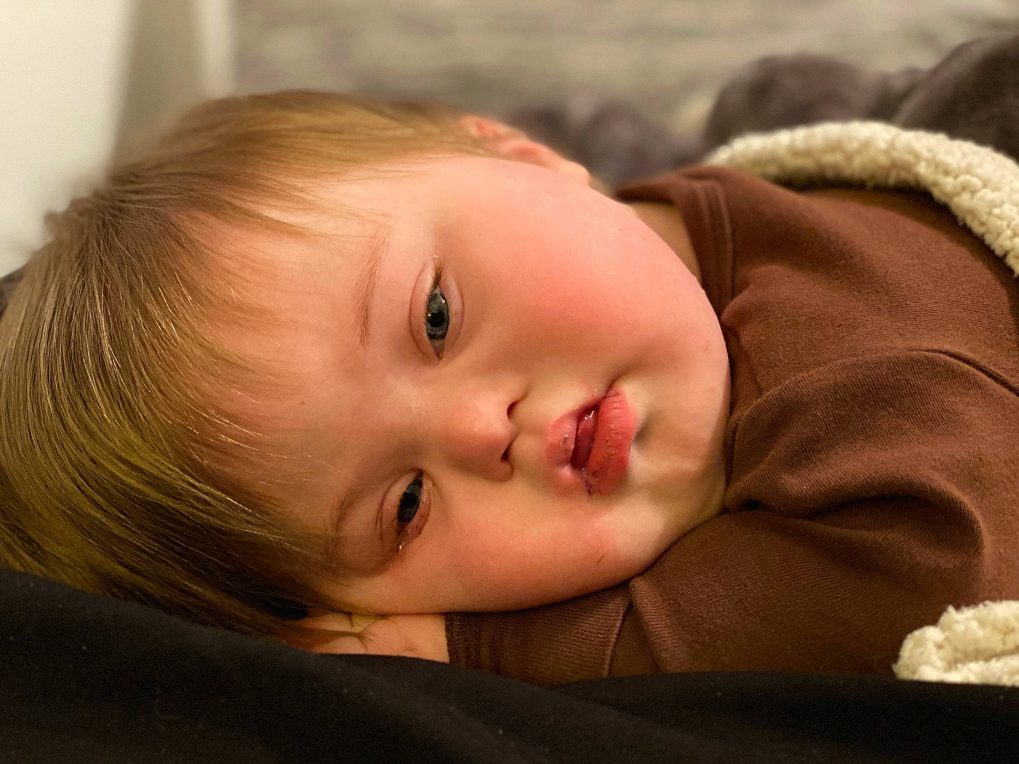 Justin Jr. is registered to the contest to win money with this photo: baby, baby_toddler_clothing, cheek, child, chin, close_up, comfort, eyebrow, eyelash, flash_photography, grass, happy, iris, lip, mouth, nose, person, skin, sleeve, smile