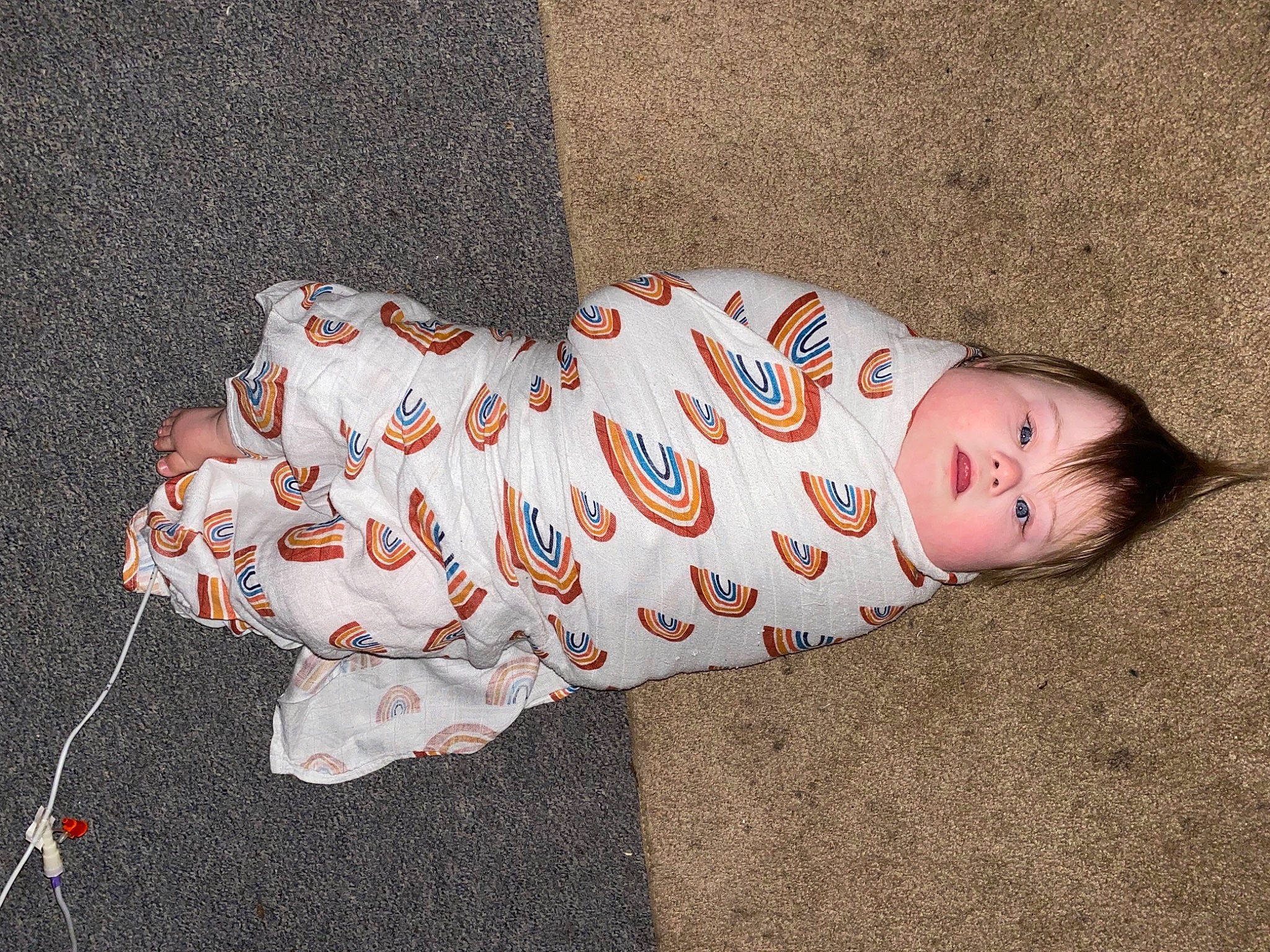 Justin Jr. is registered to the contest to win money with this photo: baby, baby_products, baby_toddler_clothing, carmine, child, comfort_food, eye, fawn, flooring, foot, grass, linens, nightwear, pattern, person, sitting, sleeve, tail, toddler, toy