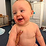 Jonah joined the competition — help win amazing prizes! baby, smiling, diaper, hand, indoor, carpet, cabinet, dog, happy, child, skin, face, cheeks, eyes, person, home, furniture, cute, infant, room
