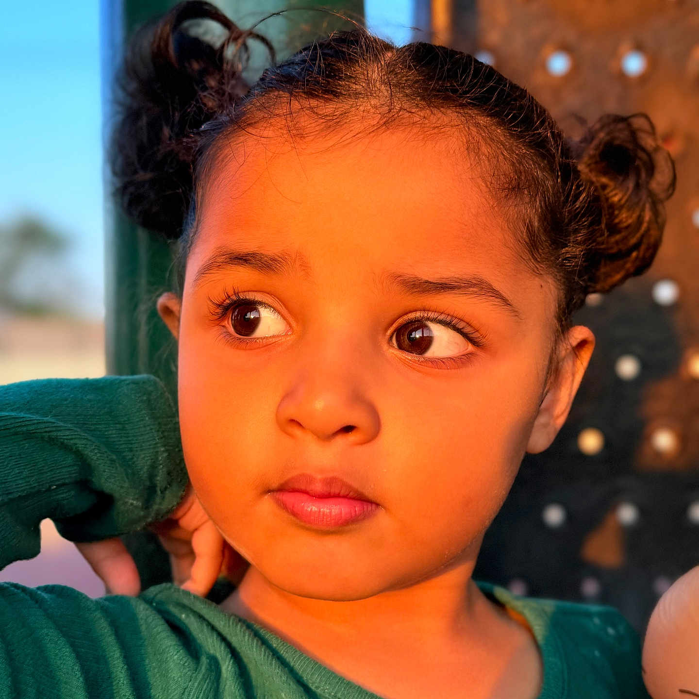 Anabia joined the competition — help win amazing prizes! brown_eyes, casual, child, clothing, curly_hair, cute, doll, expression, face, girl, green_sweater, head, outdoor, person, pigtails, portrait, skin, sunset_light, warm_light, young