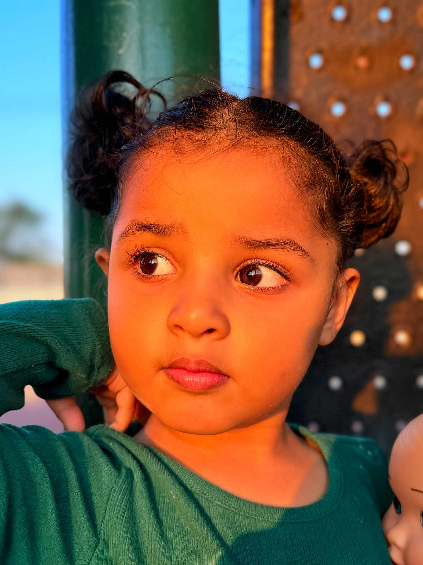 Anabia joined the competition — help win amazing prizes! child, girl, pigtails, green_sweater, doll, portrait, face, brown_eyes, curly_hair, outdoor, sunset_light, warm_light, expression, person, cute, clothing, skin, head, young, casual