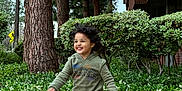 Anabia joined the competition — help win amazing prizes! child, boy, running, smiling, hoodie, pants, brown_shoes, curly_hair, outdoor, sidewalk, trees, bushes, greenery, building, daytime, playful, happy, casual_clothing, nature, urban