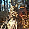 animal, autumn, backpack, camouflage, cat, daylight, forest, fur, hiking, leaves, man, nature, outdoors, pet, shoulder, sunglasses, sunlight, trees, walking, wildlife