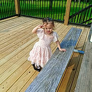 Alexander joined the competition — help win amazing prizes! child, girl, dress, pink_dress, wooden_deck, outdoor, greenery, railing, peace_sign, braided_hair, shoes, sunlight, shadow, playful, happy, person, nature, summer, young_child, smiling