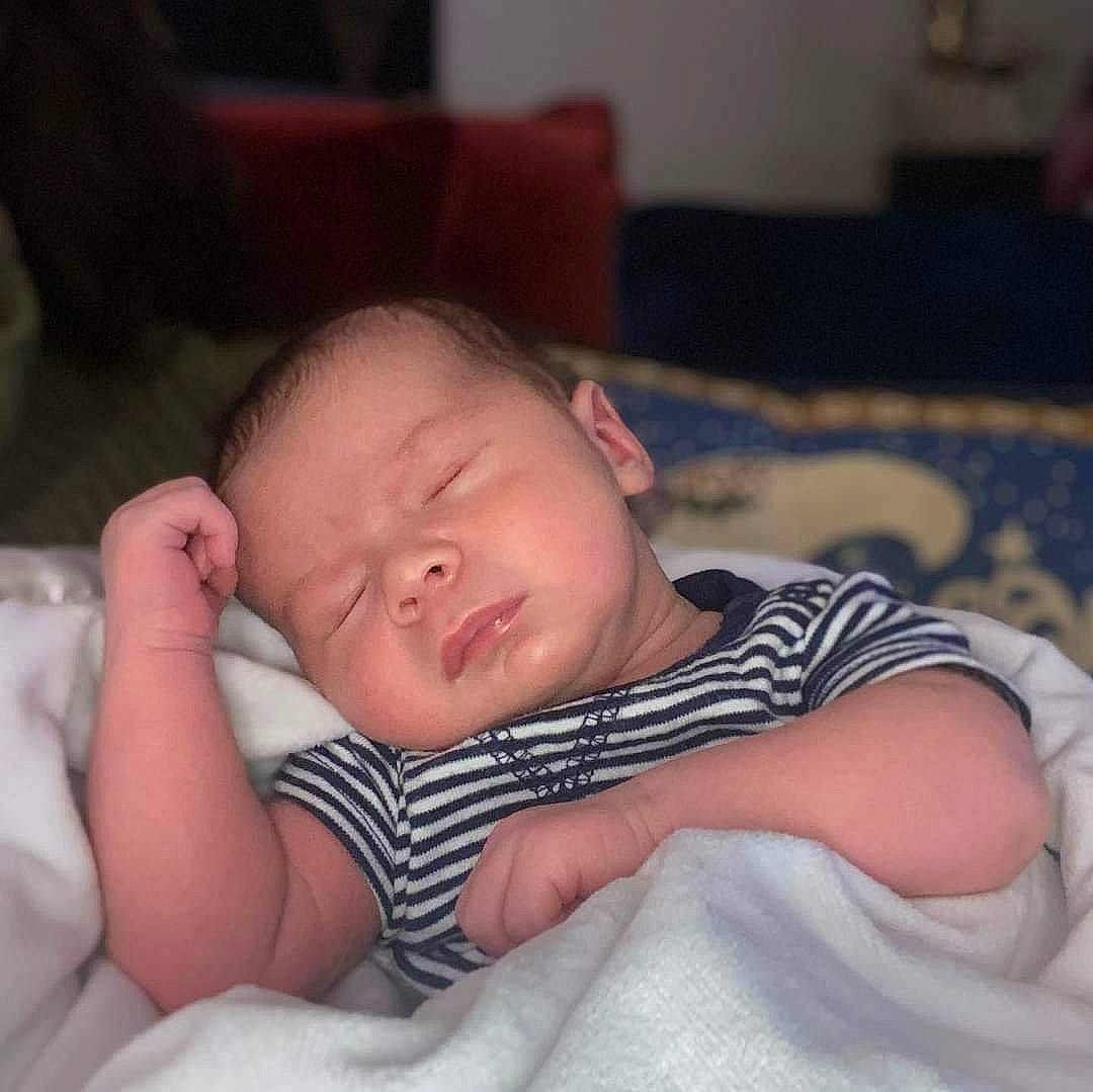 Bodhi joined the competition — help win amazing prizes! baby, baby_sleeping, baby_toddler_clothing, bedtime, carmine, cheek, child, comfort, elbow, hair, iris, linens, lip, nap, nose, person, portrait_photography, sitting, textile, thumb