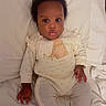 Ayla Makoni is registered to the contest to win money with this photo: baby, infant, pajamas, bed, bedding, blanket, cute, sleepwear, child, person, indoors, portrait, soft, resting, young, face, small_hands, expression, lying_down, cozy