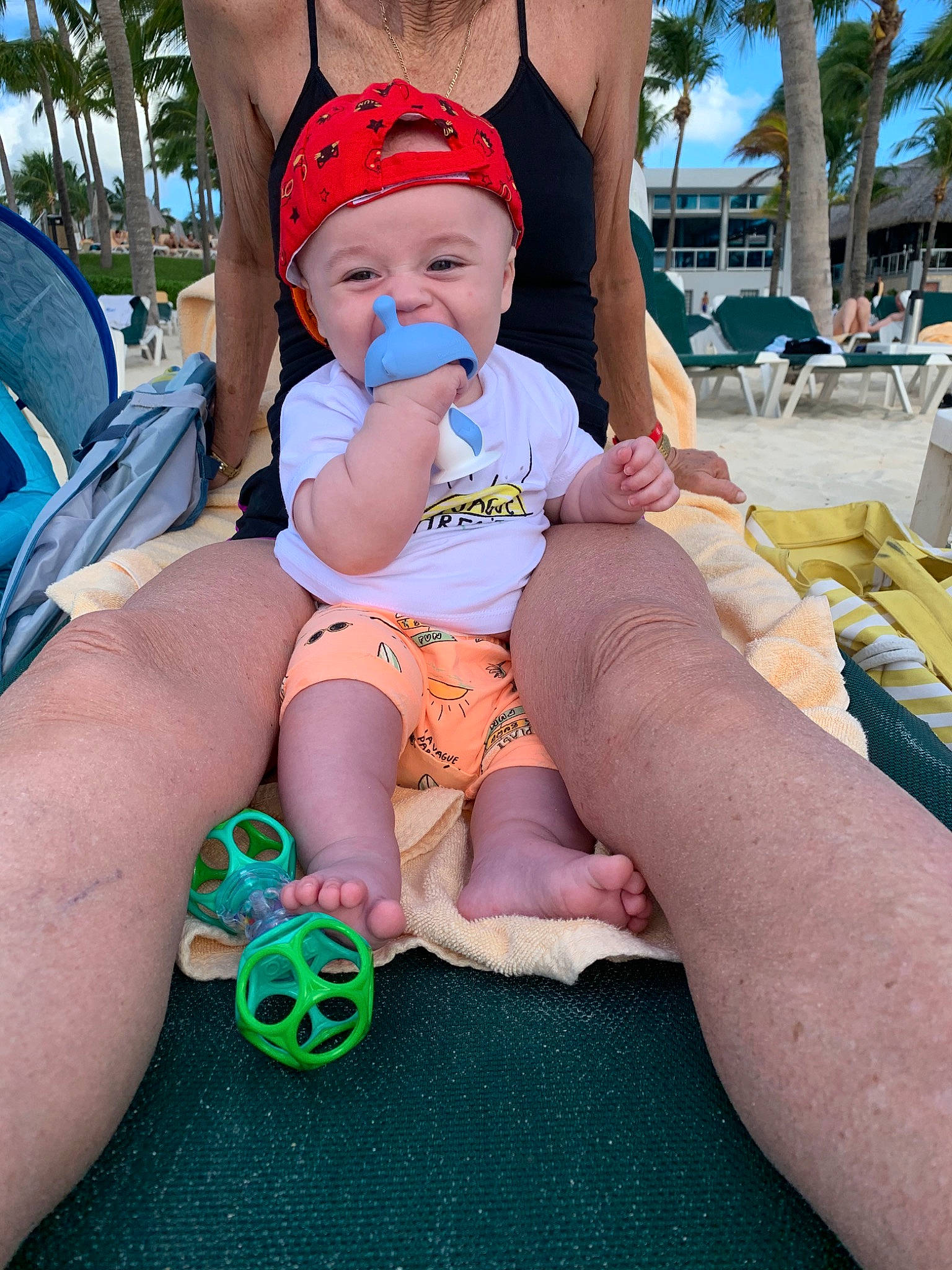 Ayden participe au concours pour gagner de l'argent avec cette photo : abdomen, baby, blue, event, foot, fun, happy, hat, headgear, headwear, human_leg, lap, leg, leisure, person, pink, recreation, shorts, summer, thigh