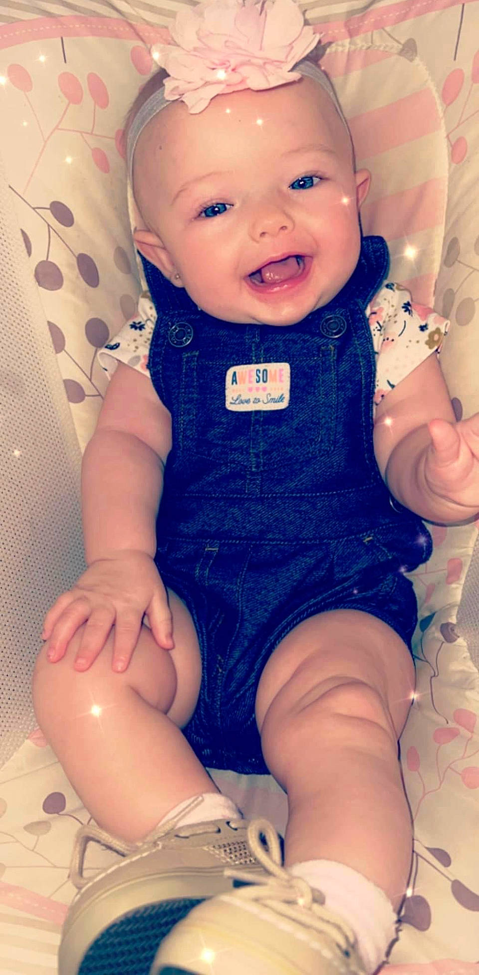 Brooklyn is registered to the contest to win money with this photo: baby, baby_toddler_clothing, blue, cheek, child, electric_blue, finger, happy, iris, pattern, person, pink, product, sitting, skin, sleeve, smile, thigh, thumb, toddler