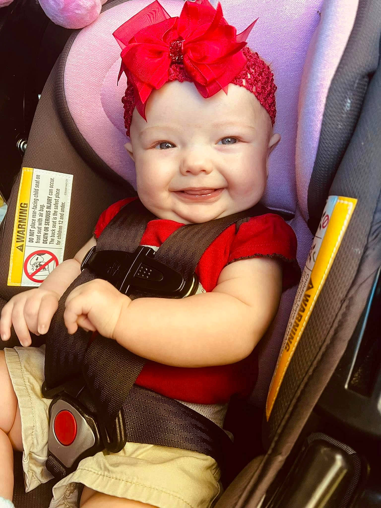 Brooklyn is registered to the contest to win money with this photo: arm, auto_part, baby, baby_carriage, baby_products, baby_toddler_clothing, car_seat, chair, child, comfort, costume_hat, eye, fashion_accessory, happy, headpiece, headwear, joy, magenta, person, skin