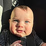 Azran is registered to the contest to win money with this photo: baby, child, car_seat, blue_eyes, sunlight, striped_shirt, face, infant, cute, smile, hand, seatbelt, portrait, indoors, skin, person, young_child, closeup, happy, adorable