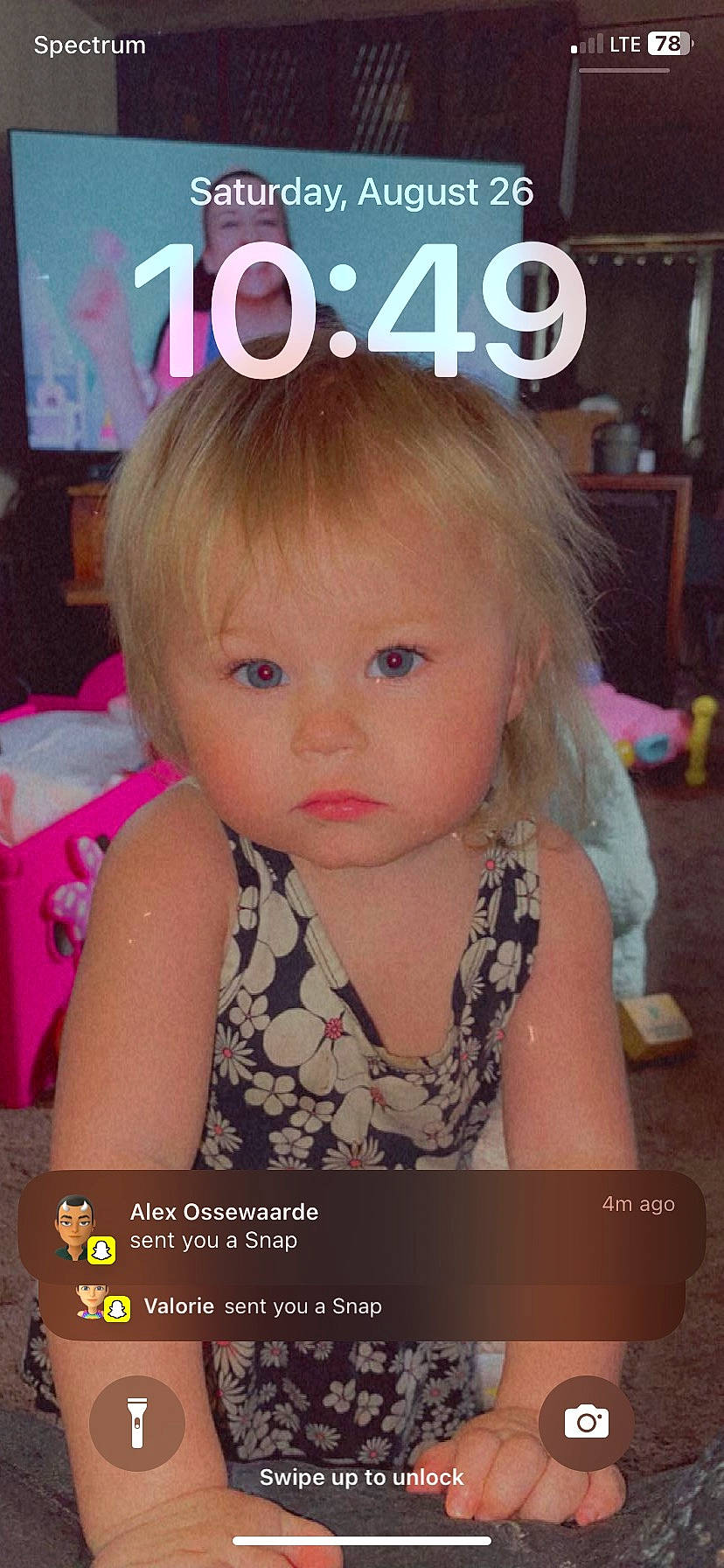 Posie is registered to the contest to win money with this photo: baby_toddler_clothing, bangs, blond, brown_hair, cheek, child, ear, eyebrow, eyelash, font, fun, happy, iris, nose, person, photo_caption, picture_frame, pink, room, skin