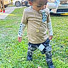 Kairo joined the competition — help win amazing prizes! toddler, child, pacifier, gold_chain, long_sleeve_shirt, distressed_pants, sneakers, grass, outdoor, parked_cars, person, daylight, tags, curly_hair, standing, looking_down, casual, urban, sidewalk, nature