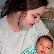 Oaklynn is registered to the contest to win money with this photo: affection, baby, child, clothing, expression, face, family, hair, holding, indoor, infant, love, necklace, onesie, person, portrait, skin, smile, tender, woman