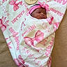 Kailani joined the competition — help win amazing prizes! newborn, baby, infant, sleeping, swaddled, pink, headband, bow, blanket, portrait, face, indoors, couch, cozy, peaceful, announcement, wooden_sign, text, close_up, new_parent