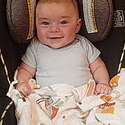 Royce is registered to the contest to win money with this photo: baby, baby_toy, blanket, car_seat, child, clothing, comfort, cute, face, happy, head, holding, indoor, infant, newborn, portrait, seat, skin, smiling, young_child