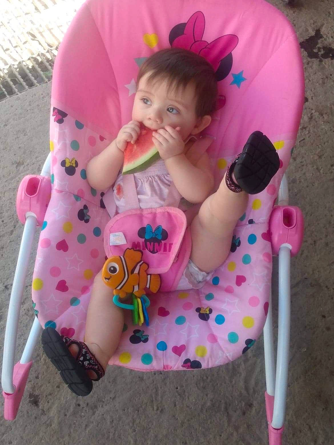 Brianna is registered to the contest to win money with this photo: baby, baby_products, baby_toddler_clothing, cap, chair, child, clothing, comfort, fun, grass, happy, head, magenta, pattern, person, pink, recreation, skin, sleeve, toddler