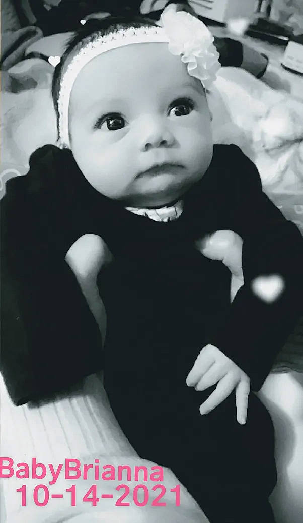 Brianna is registered to the contest to win money with this photo: baby, baby_toddler_clothing, black, black_and_white, cheek, child, costume_hat, eyelash, fashion_accessory, flash_photography, happy, hat, monochrome, monochrome_photography, person, photograph, portrait_photography, sitting, sleeve, style