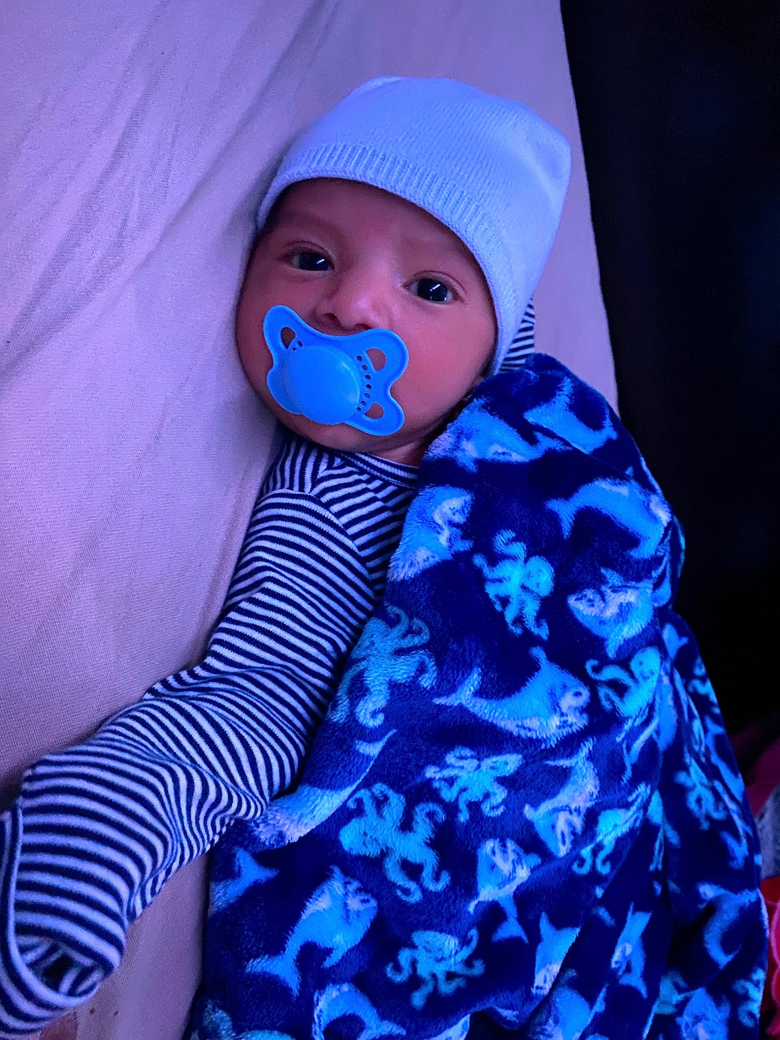 Iván joined the competition — help win amazing prizes! azure, baby, baby_products, baby_toddler_clothing, beanie, blue, cap, child, electric_blue, headwear, linens, magenta, pattern, person, personal_protective_equipment, purple, service, sleeve, textile, thumb