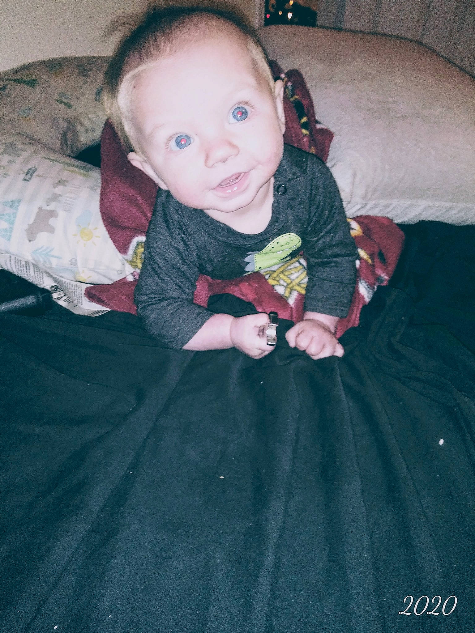 Fynnlee joined the competition — help win amazing prizes! arm, baby, baby_toddler_clothing, black, cheek, comfort, couch, dress, eye, face, finger, flash_photography, hair, hand, head, iris, mouth, person, skin, sleeve