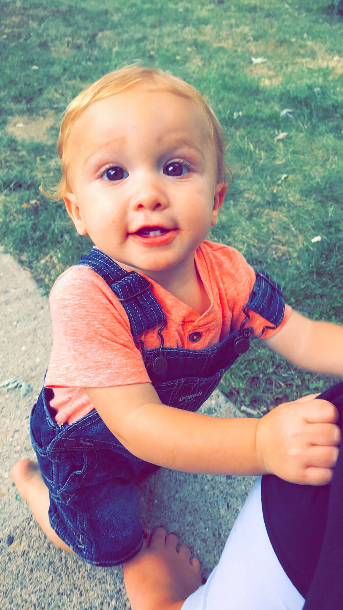 Nash is registered to the contest to win money with this photo: baby, beauty, blond, cheek, child, eye, face, facial_expression, grass, head, lip, nose, people, person, pink, play, skin, smile, summer, toddler