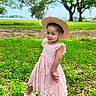 toddler, child, girl, pink_dress, straw_hat, green_grass, flowers, outdoor, nature, park, smile, playful, summer, sunny, footwear, leaves, young, portrait, cute, fashion