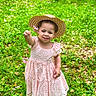 Brielle joined the competition — help win amazing prizes! child, girl, flower, pink_dress, straw_hat, grass, greenery, outdoor, nature, smile, happy, summer, cute, portrait, young_child, playful, sunlight, meadow, footwear, small_flower