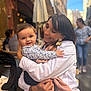Ghjulia-Victoria a rejoint le concours — aidez-le/la à gagner de superbes lots ! baby, woman, child, smile, hug, outdoor, cafe, people, street, daylight, clothing, stroller, happy, portrait, person, holding, casual, urban, family, love