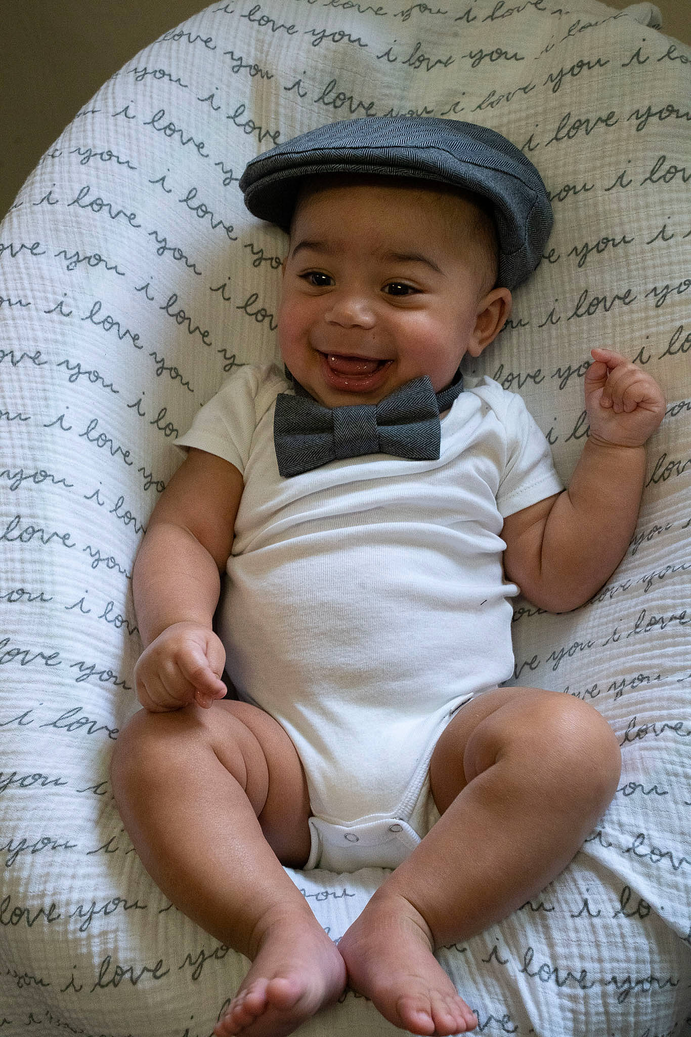 Kayson is registered to the contest to win money with this photo: baby, baby_toddler_clothing, cap, cheek, child, chin, comfort, fashion_accessory, flash_photography, happy, hat, head, headgear, human_leg, joy, person, sitting, skin, smile, sun_hat