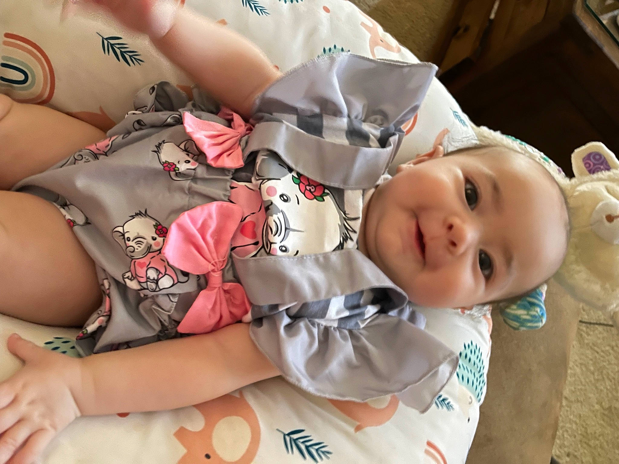 Sapphire is registered to the contest to win money with this photo: baby, baby_products, baby_toddler_clothing, carmine, cheek, chest, child, comfort, elbow, happy, human_leg, mouth, nail, pattern, person, skin, sleeve, smile, textile, thigh