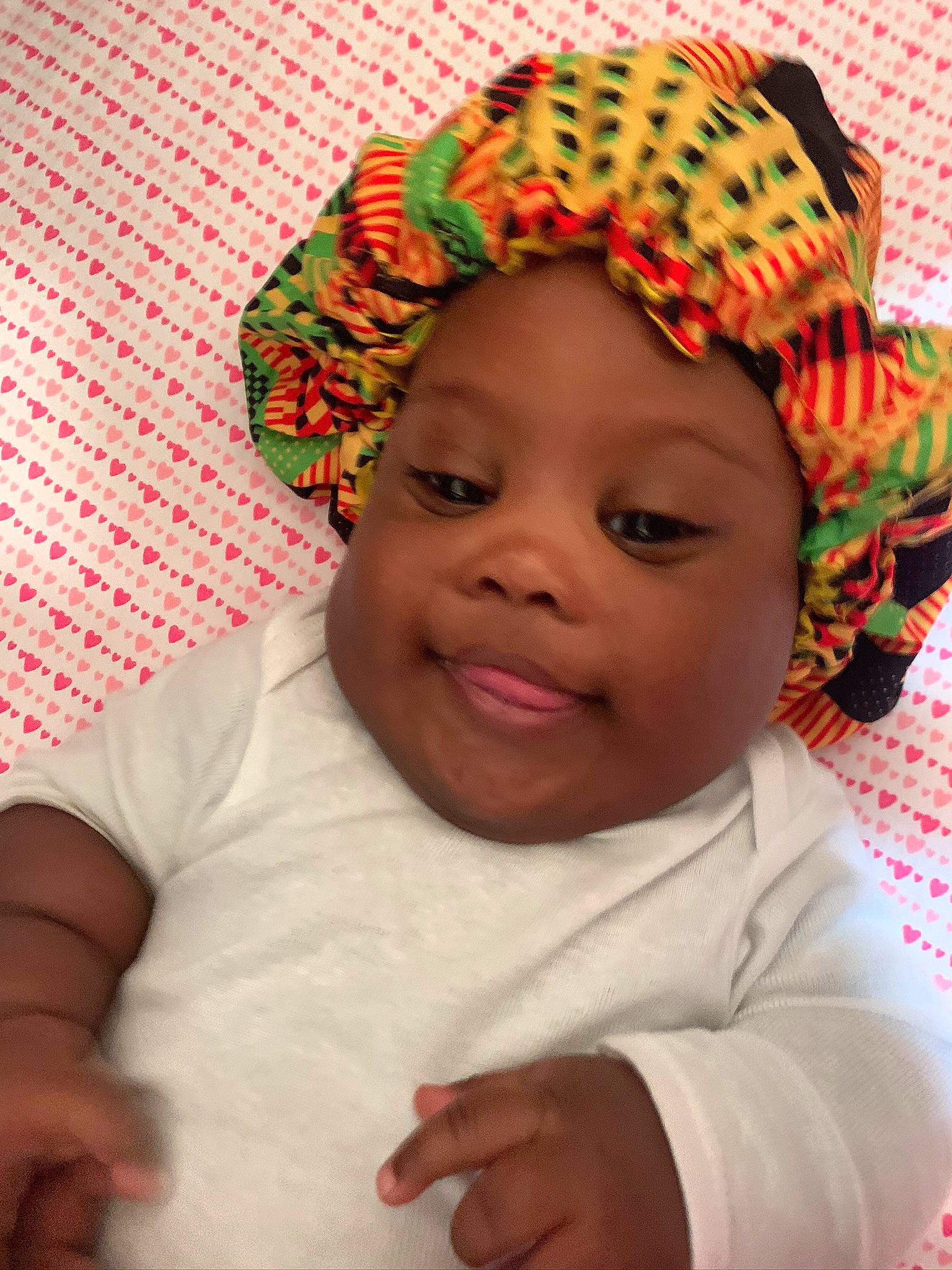 Kansys is registered to the contest to win money with this photo: baby_toddler_clothing, cap, cheek, chin, cool, eye, eyebrow, face, happy, head, headgear, headwear, human_body, lip, mouth, nose, person, pink, skin, sleeve